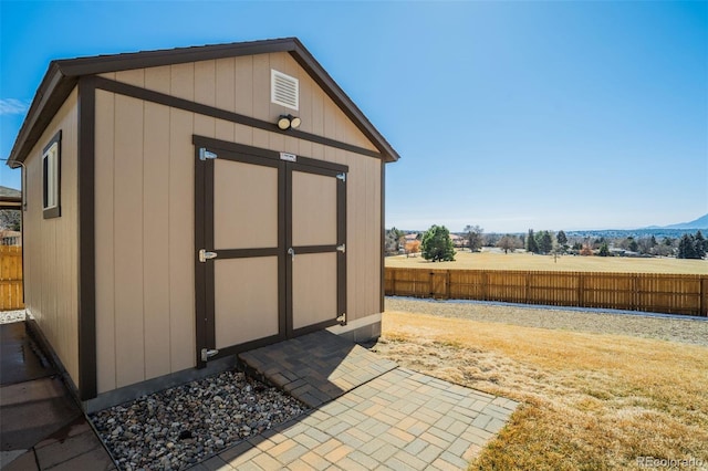 view of shed with fence