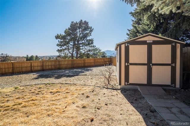 view of shed with a fenced backyard