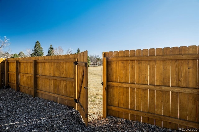 view of gate featuring fence