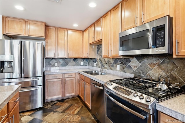 kitchen with sink, stainless steel appliances, and backsplash