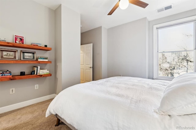 bedroom featuring ceiling fan and carpet