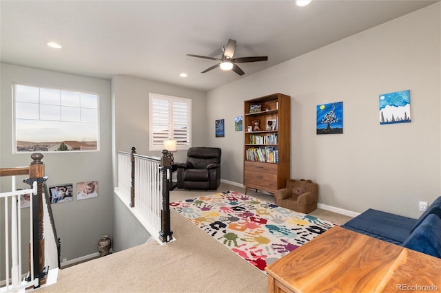 playroom featuring ceiling fan and carpet