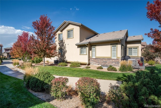 view of side of property featuring a yard