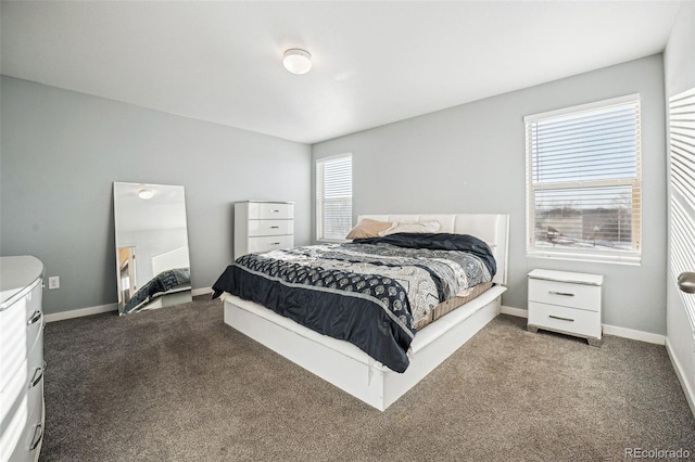 carpeted bedroom with baseboards