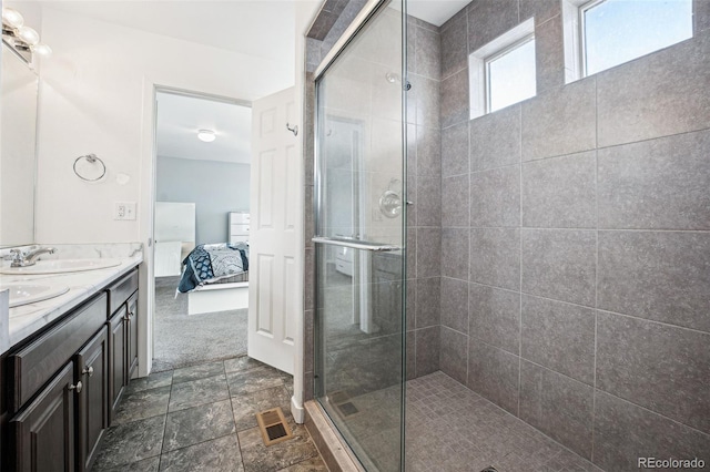 bathroom with double vanity, visible vents, tiled shower, ensuite bath, and a sink