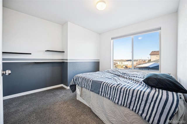 carpeted bedroom with baseboards