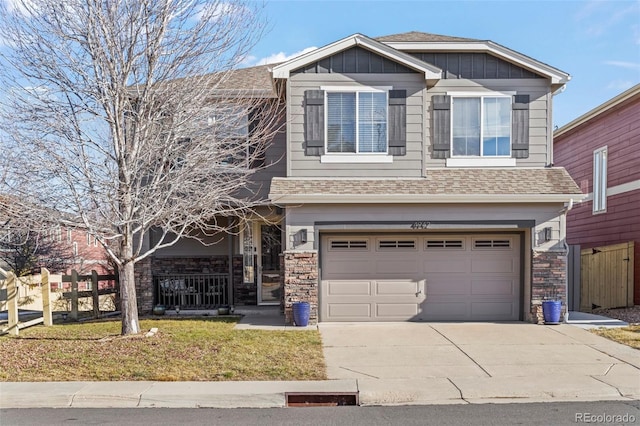 view of front of home with a garage and a front yard