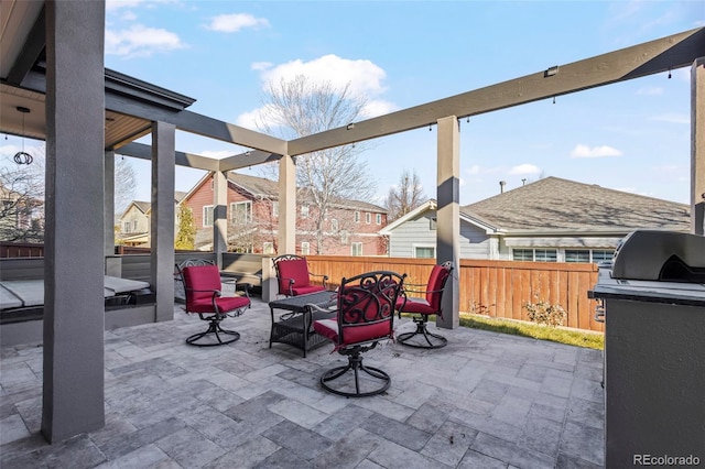 view of patio with grilling area and an outdoor hangout area