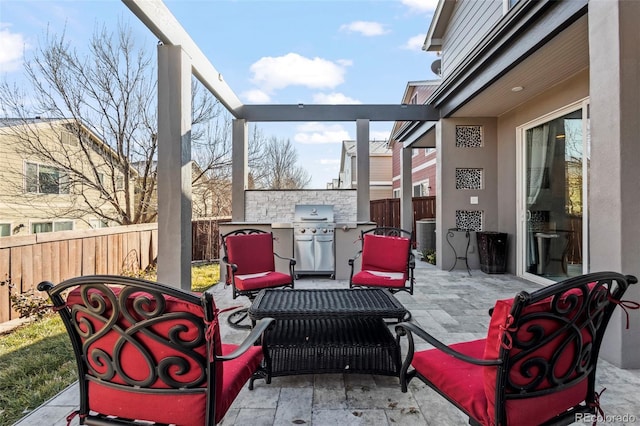 view of patio featuring grilling area and cooling unit