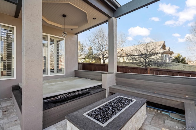 view of patio with a fire pit