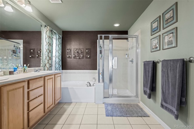 bathroom featuring tile patterned floors, plus walk in shower, and vanity