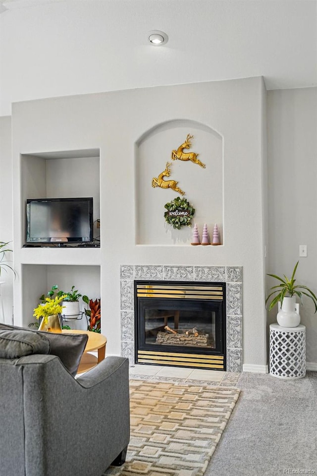 living room featuring a high end fireplace, carpet flooring, recessed lighting, and baseboards
