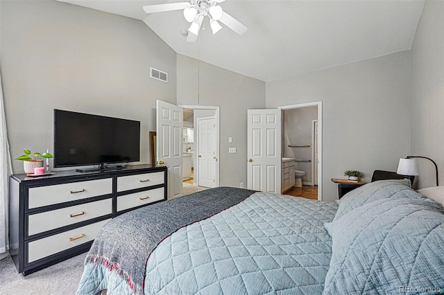 bedroom with light colored carpet, baseboards, connected bathroom, ceiling fan, and high vaulted ceiling