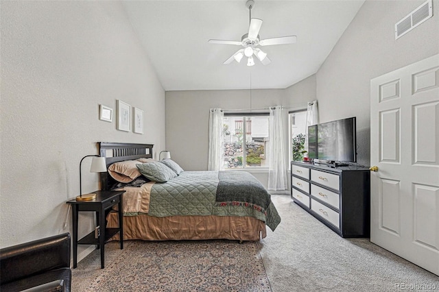 bedroom featuring vaulted ceiling, carpet, and a ceiling fan