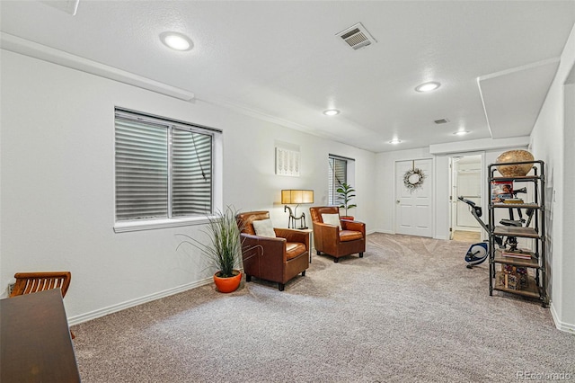 sitting room with carpet flooring, recessed lighting, and baseboards
