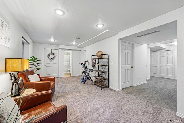 sitting room featuring carpet, recessed lighting, and baseboards