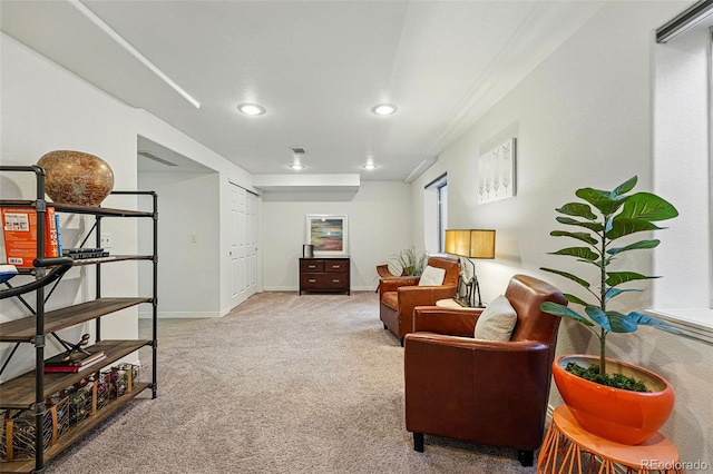 living area featuring carpet flooring, recessed lighting, and baseboards