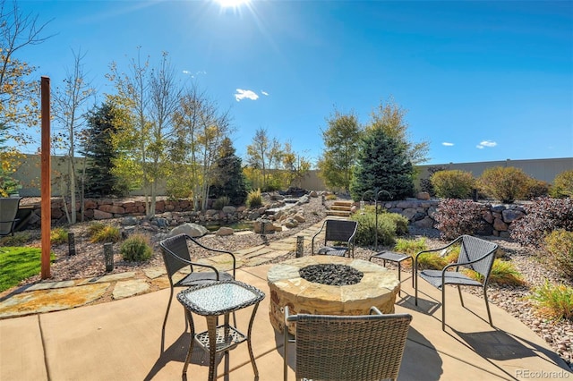 view of patio featuring an outdoor fire pit