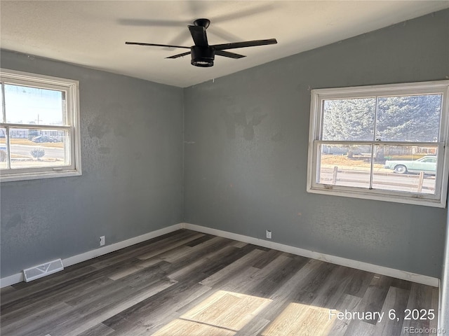 unfurnished room with ceiling fan, wood-type flooring, lofted ceiling, and a wealth of natural light