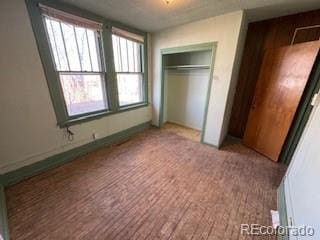 unfurnished bedroom featuring a closet