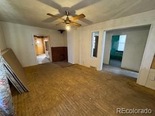 interior space with ceiling fan