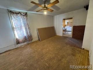 spare room with ceiling fan