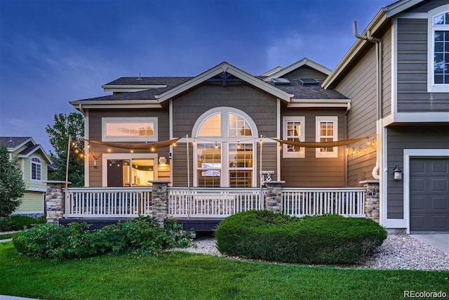 view of front of house featuring a garage and covered porch