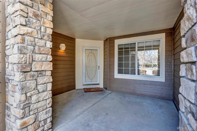 view of exterior entry with stone siding