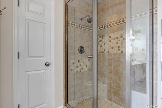 bathroom with a shower stall