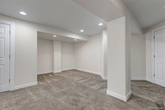 finished below grade area with carpet floors, baseboards, and recessed lighting