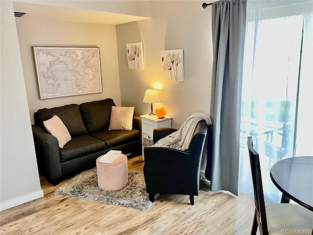 5295 Andes St, Denver, CO 80249 - living area featuring wood finished floors and baseboards