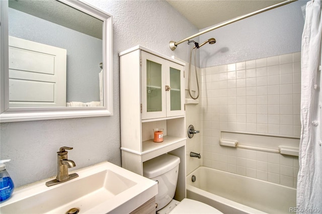 5295 Andes St, Denver, CO 80249 - bathroom featuring a sink, a textured wall, toilet, and shower / bathtub combination with curtain