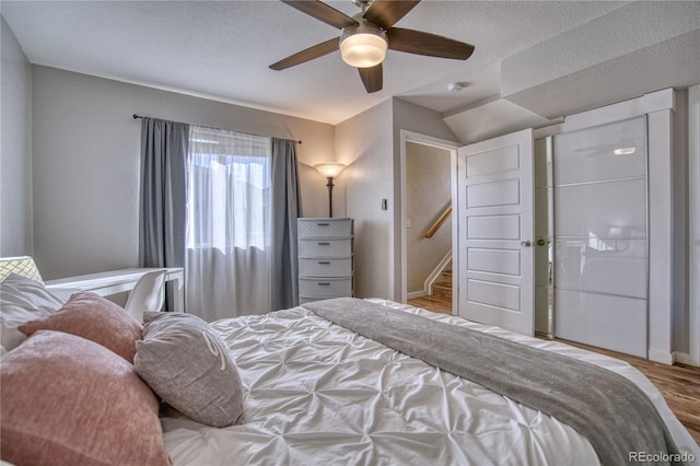 5295 Andes St, Denver, CO 80249 - bedroom with wood finished floors, lofted ceiling, ceiling fan, a textured ceiling, and baseboards
