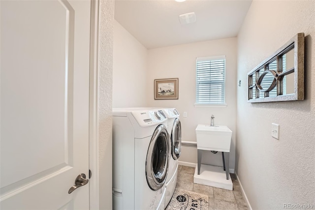 clothes washing area featuring visible vents, baseboards, laundry area, light tile patterned flooring, and independent washer and dryer