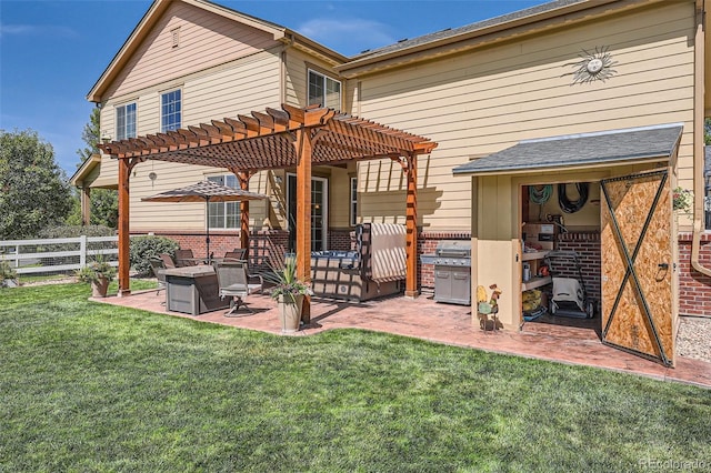 rear view of property with brick siding, a pergola, a patio, and fence