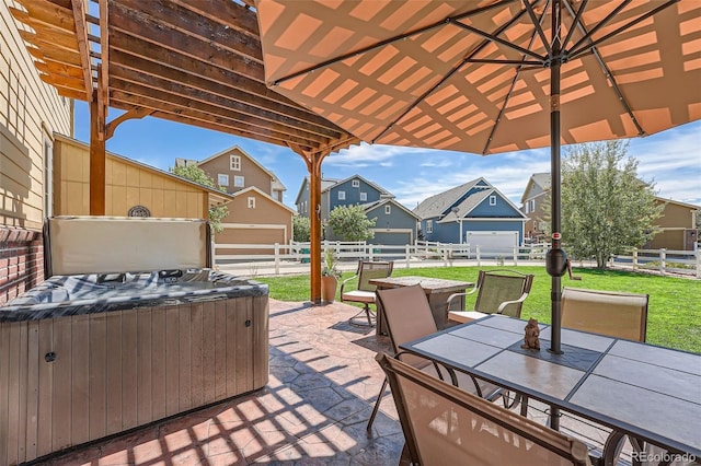 view of patio / terrace featuring a residential view, fence, outdoor dining space, and a hot tub