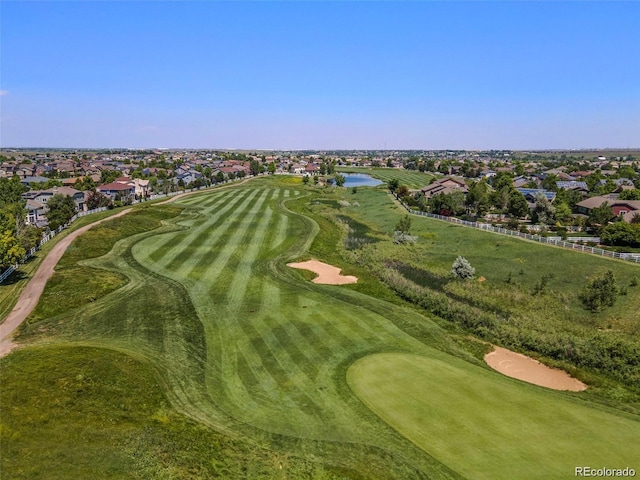 bird's eye view with view of golf course and a water view