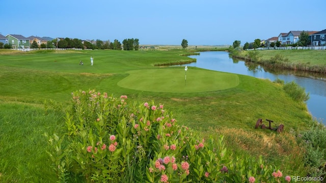 view of home's community featuring a water view and golf course view