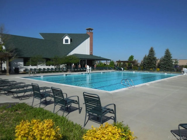 community pool featuring a patio area