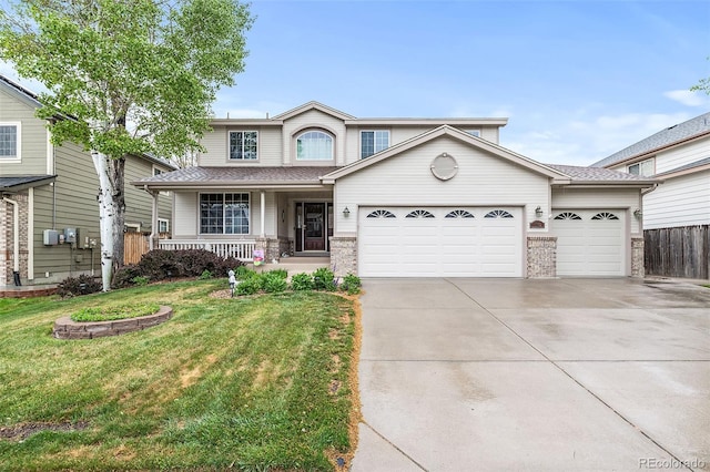 view of front of property with an attached garage, driveway, and a porch