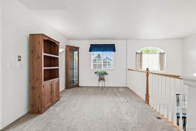 empty room with carpet flooring and baseboards