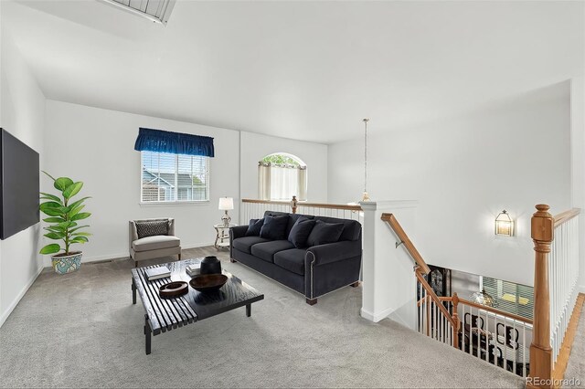 living room with carpet and baseboards