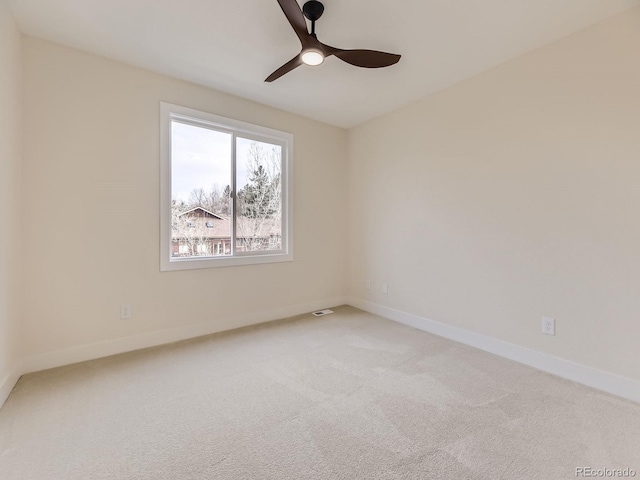 carpeted empty room with ceiling fan