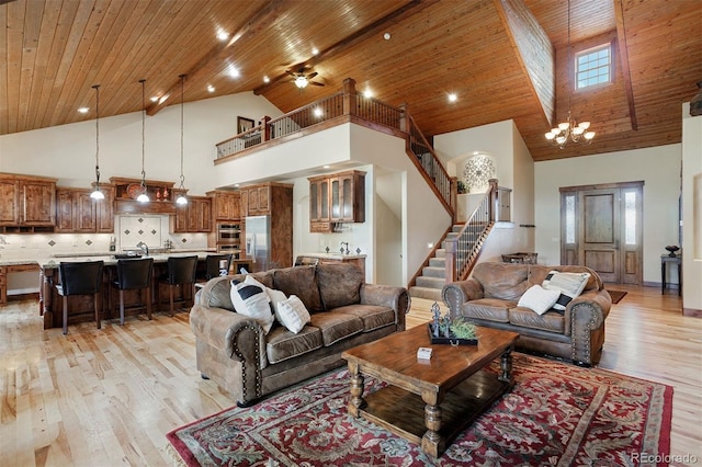 living room with wooden ceiling, high vaulted ceiling, and light hardwood / wood-style floors