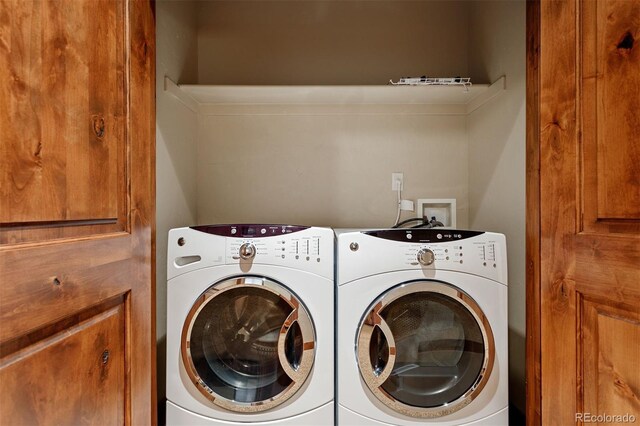 laundry area featuring washing machine and clothes dryer