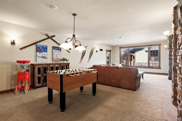 rec room with light carpet and a textured ceiling