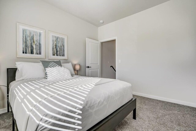 2220 E Ln Salle St Unit 108, Colorado Springs, CO 80909 - bedroom with carpet flooring and baseboards