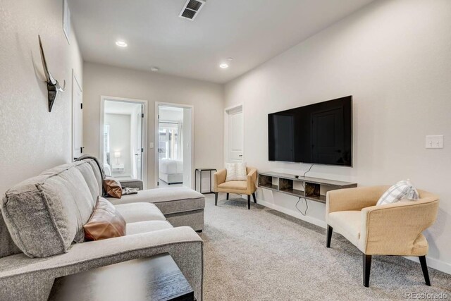 2220 E Ln Salle St Unit 108, Colorado Springs, CO 80909 - living room with baseboards, visible vents, carpet floors, and recessed lighting