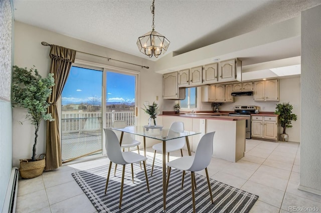 dining space featuring a chandelier, light tile patterned flooring, a textured ceiling, and baseboard heating