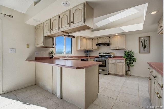 kitchen featuring a peninsula, under cabinet range hood, stainless steel electric range, and light tile patterned floors